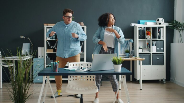 Coworkers taking an active break during a monthly wellness challenge