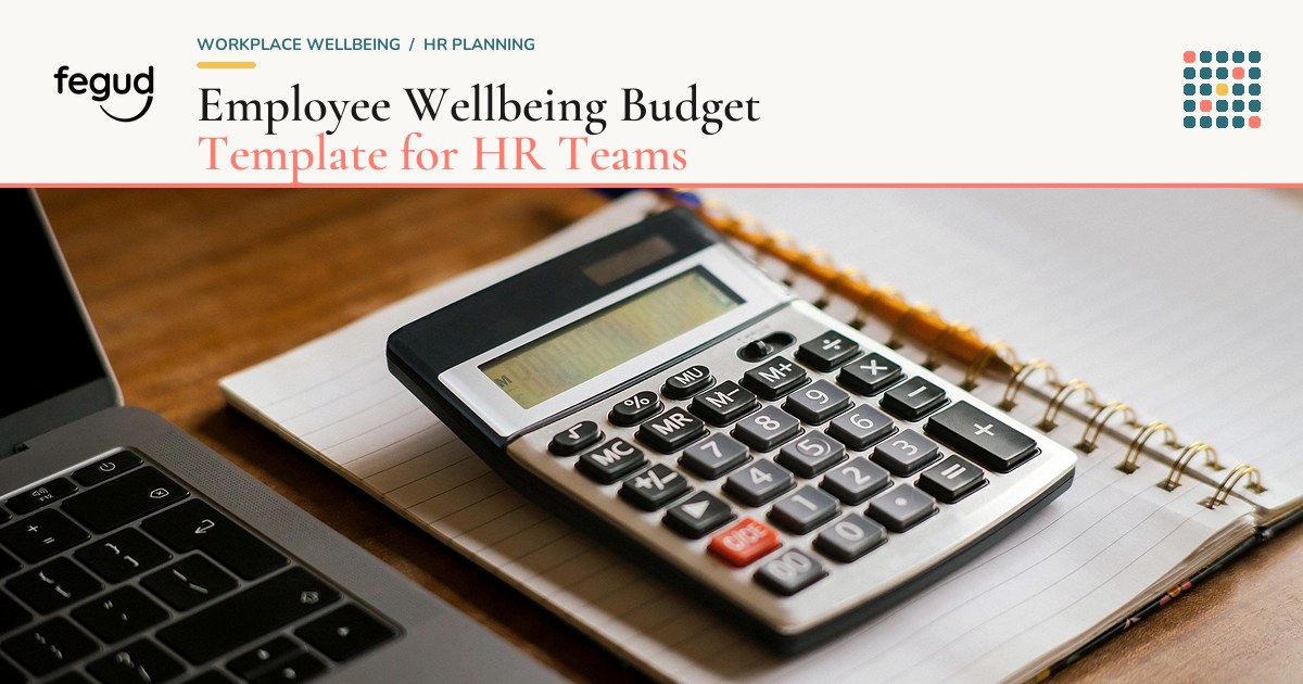 Laptop, calculator, and spreadsheet used to plan an employee wellbeing budget