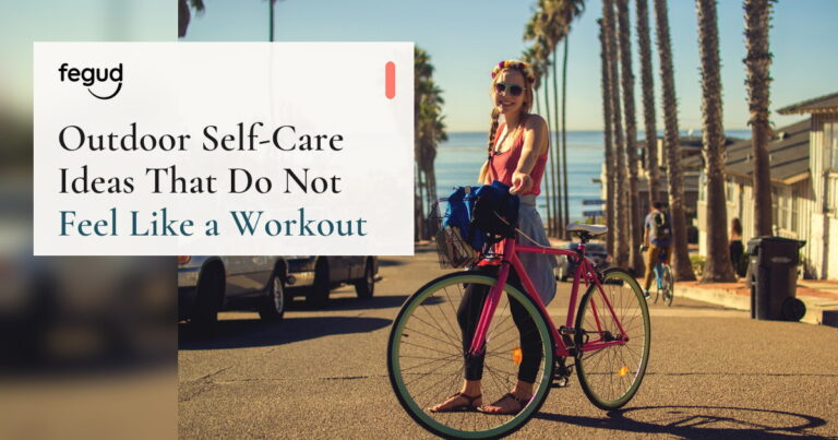 Woman with a bicycle by the sea considering outdoor self-care ideas
